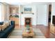 Inviting living room boasting a cozy fireplace, stylish furnishings, and a convenient coffee and snack bar at 3596 Walter Drive Dr, Johns Island, SC 29455
