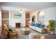 Bright living room features wicker seating, fireplace, hardwood floors, modern furniture and a view of the ocean at 3596 Walter Drive Dr, Johns Island, SC 29455