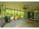 View of a partially covered porch featuring a ceiling fan, grill, and sliding glass door at 3596 Walter Drive Dr, Johns Island, SC 29455