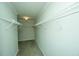 Empty walk-in closet featuring metal racks on each side and carpeted floors at 3596 Walter Drive Dr, Johns Island, SC 29455
