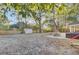 Fenced backyard with a shed, fire pit, outdoor seating area and leafy ground cover at 402 Corey Blvd, Summerville, SC 29483