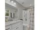 Bright bathroom features a shower/tub, marble countertops and vanity at 402 Corey Blvd, Summerville, SC 29483
