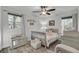 Comfortable bedroom with ample natural light, soft rug, and charming furnishings at 402 Corey Blvd, Summerville, SC 29483
