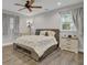 Inviting bedroom features wood floors, tray ceiling, and built-in storage beneath bed at 402 Corey Blvd, Summerville, SC 29483