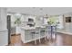 Bright kitchen with stainless steel appliances, island with marble countertop, and hardwood floors at 402 Corey Blvd, Summerville, SC 29483