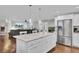 Kitchen island with a marble countertop and stainless steel refrigerator in an open concept living space at 402 Corey Blvd, Summerville, SC 29483