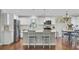 Bright kitchen with stainless steel appliances, white cabinets, and center island with seating at 402 Corey Blvd, Summerville, SC 29483