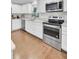 Bright kitchen with stainless steel appliances, marble countertop, and hardwood floors at 402 Corey Blvd, Summerville, SC 29483