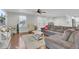 Cozy living room with wood floors, a plush sectional, and natural light at 402 Corey Blvd, Summerville, SC 29483