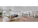 Open-concept living room with hardwood floors, leading to the kitchen and dining area at 402 Corey Blvd, Summerville, SC 29483