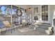 Relaxing screened-in porch with outdoor furniture and access to backyard at 402 Corey Blvd, Summerville, SC 29483