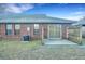 Cozy brick home features a small back patio area with lawn and a wooden privacy fence at 425 Miami St # A, Ladson, SC 29456