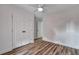 Bright bedroom featuring wood-look floors, and a double door closet at 425 Miami St # A, Ladson, SC 29456