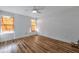 Bright bedroom with wood-look floors, ceiling fan and natural light at 425 Miami St # A, Ladson, SC 29456