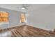 Bright bedroom with wood-look floors, ceiling fan and natural light at 425 Miami St # A, Ladson, SC 29456