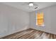 Bright bedroom featuring wood-look floors, ceiling fan and natural light at 425 Miami St # A, Ladson, SC 29456