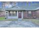 Charming single-story home with brick and vinyl siding, a covered porch, and a well-maintained front yard at 425 Miami St # A, Ladson, SC 29456