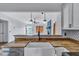 Close-up of the kitchen featuring a farmhouse sink, butcher block counters, and a view into the living area at 425 Miami St # A, Ladson, SC 29456