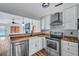 Well-lit kitchen featuring modern appliances, butcher block counters, and an open view to the living room area at 425 Miami St # A, Ladson, SC 29456