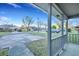 View from the porch of this house showcasing the neighborhood street and surrounding homes on a sunny day at 425 Miami St # A, Ladson, SC 29456