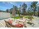 Inviting back deck area with comfortable seating and an umbrella providing shade on a sunny day at 425 Verbena Ave, Summerville, SC 29483