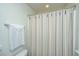 Bathroom featuring a shower with curtain, towel bar, neutral decor and fresh ambience at 425 Verbena Ave, Summerville, SC 29483