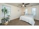 Simple bedroom with neutral walls, carpeted floor and plenty of natural light from two windows at 425 Verbena Ave, Summerville, SC 29483