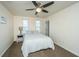 Cozy bedroom featuring a queen-sized bed, ceiling fan, and neutral decor for a relaxing ambiance at 425 Verbena Ave, Summerville, SC 29483