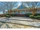 The front entrance of the clubhouse with shrubbery and landscaping at 425 Verbena Ave, Summerville, SC 29483