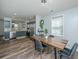 Open dining area next to the kitchen featuring modern table and bar with chairs and natural light at 425 Verbena Ave, Summerville, SC 29483