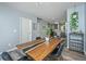 Dining space with a wooden table, stylish chairs, wood-look flooring, and natural light at 425 Verbena Ave, Summerville, SC 29483