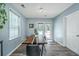 Modern dining room featuring a wood table, stylish chairs, and natural light, perfect for gatherings at 425 Verbena Ave, Summerville, SC 29483