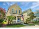 Charming two-story home featuring a welcoming front porch and patriotic American flag at 425 Verbena Ave, Summerville, SC 29483