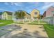 Exterior view of colorful homes with white picket fences and grass yards at 425 Verbena Ave, Summerville, SC 29483
