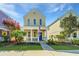 Charming two-story home with a welcoming front porch, well-kept lawn, and colorful flowers, creating an inviting outdoor space at 425 Verbena Ave, Summerville, SC 29483