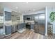 Stylish kitchen with stainless steel appliances, granite countertops, and gray-blue cabinets at 425 Verbena Ave, Summerville, SC 29483