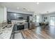 Open concept kitchen with granite counters, stainless steel appliances and view to dining area at 425 Verbena Ave, Summerville, SC 29483