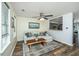 Comfortable living room featuring a sectional sofa, ceiling fan, and view into the kitchen at 425 Verbena Ave, Summerville, SC 29483