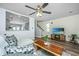 Inviting living room featuring stylish seating, modern decor, wood-look floors, and an open view to the staircase at 425 Verbena Ave, Summerville, SC 29483