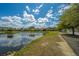 Scenic view of a pond on a sunny day, with houses and trees in the background at 425 Verbena Ave, Summerville, SC 29483