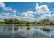 Beautiful view of a pond surrounded by trees and houses in a beautiful neighborhood at 425 Verbena Ave, Summerville, SC 29483