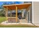 Backyard showing a wooden pergola with seating, and a backyard gazebo with hot tub at 436 Blue Elderberry, Moncks Corner, SC 29461