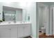 Bright bathroom features double vanity, framed mirrors, and a shower with glass doors at 436 Blue Elderberry, Moncks Corner, SC 29461