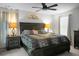 Comfortable bedroom features a full bed, dark wood furniture, natural light, and bedside lamps at 436 Blue Elderberry, Moncks Corner, SC 29461