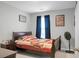 Cozy bedroom features dark wood furniture, decorative fan, and a comfortable bed with patterned bedding at 436 Blue Elderberry, Moncks Corner, SC 29461