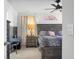 Comfortable bedroom features a full bed, dark wood furniture, natural light, and a ceiling fan at 436 Blue Elderberry, Moncks Corner, SC 29461