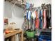Well-organized closet with hanging clothes, shelving, and storage containers for efficient space utilization at 436 Blue Elderberry, Moncks Corner, SC 29461