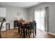 Cozy dining area with hardwood floors, dining table, and sliding glass door at 436 Blue Elderberry, Moncks Corner, SC 29461