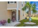 Charming front entrance with lush landscaping, a decorative palm tree, and a welcoming front door with seasonal decor at 436 Blue Elderberry, Moncks Corner, SC 29461