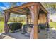 Backyard gazebo featuring a hot tub, grilling area and outdoor lighting at 436 Blue Elderberry, Moncks Corner, SC 29461